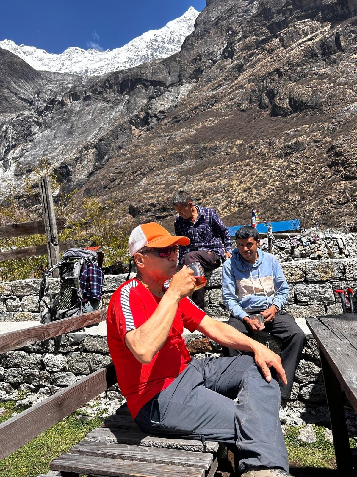 Tea on a teahouse bench below the snow line
